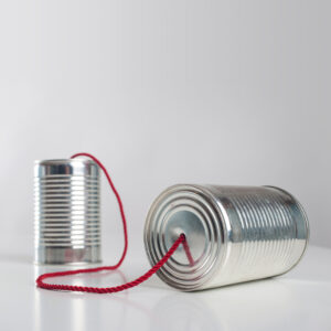 Can,Telephone,With,Red,Wire.,Conceptual,Communication,Image.Kommunikationstraining